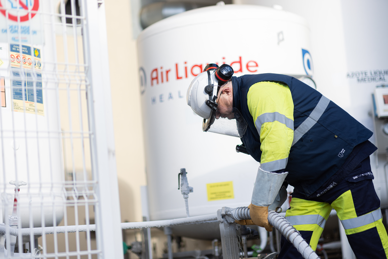 Technician filling a tank 01