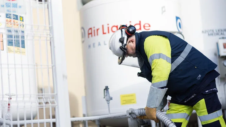 Technician filling a tank 01