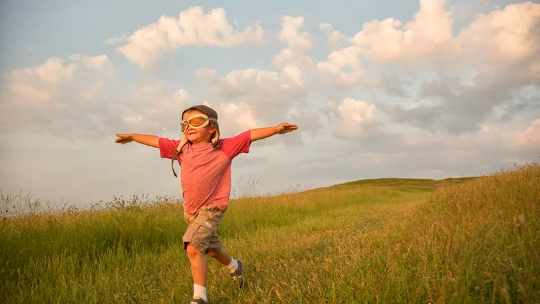 Boy running in a field 